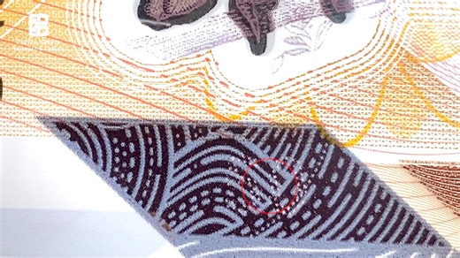 Look carefully at the TT$50 polymer bank note to observe its security...
