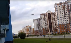 UFO visible only through shard of glass