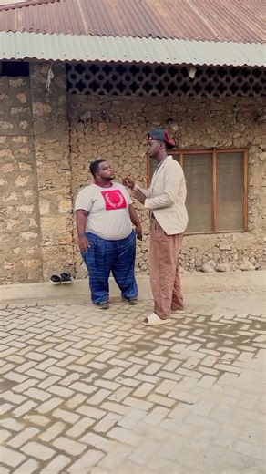 Humorous Outdoor Struggle Between Two Friends