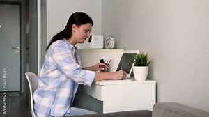 A freelance mom is distracted from her work when her daughter comes up to her.