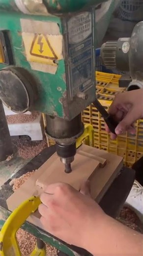 the process of drilling holes in wood using a machine to make it faster