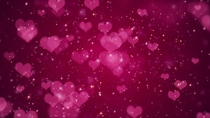 Download Cute pink hearts, shiny stars and glowing glittering particles on dark red gradient background. This shiny romantic Valentine's Day background is full HD and a seamless loop. for free