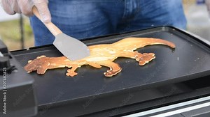 Baking pancakes. 3D printer for liquid dough. 3D printer printing pancakes with dough different shapes close-up. Modern additive technologies 4.0 industrial revolution. Progressive food technology