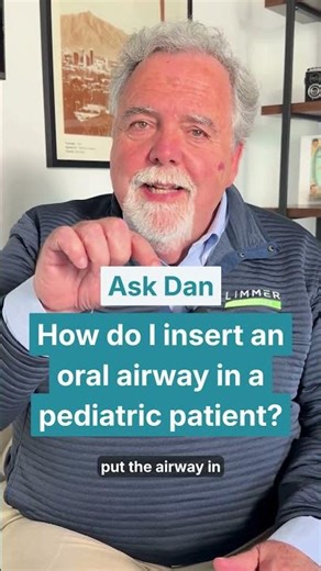 How do I insert an oral airway in a pediatric patient?