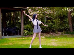 Cute Asian Girl wearing Japanese School Uniform dancing in the backyard
