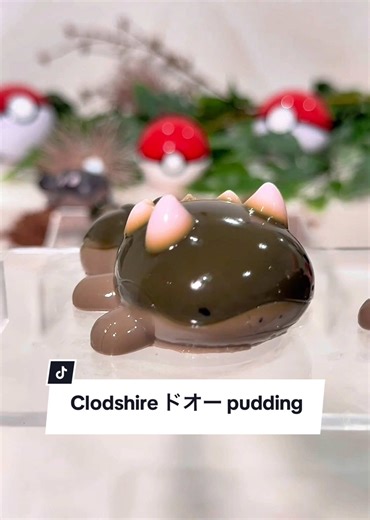 Chocolate pudding has never been more exciting than molded into the shape of Clodsire! I used milk and dark chocolate for the pudding, and violet petal syrup for the ‘poison acid.’ Even the chocolate soil in the back was edible - making a wholesome dessert 😆 #pokemon #clodsire #pudding #dessert #ポケモン #ドオー #プリン #ふわふわ