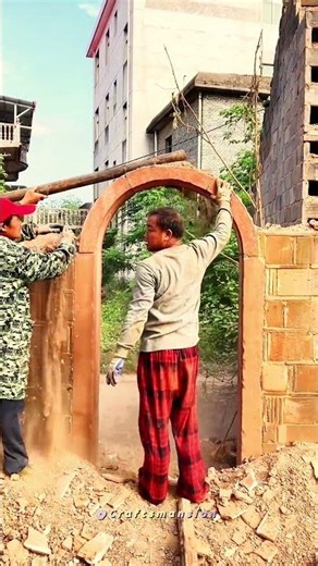 Manual Demolition: Carefully Dismantling a Brick Archway and Wall