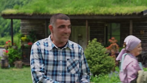 Cooking a Massive Fish Over Fire in the Mountains