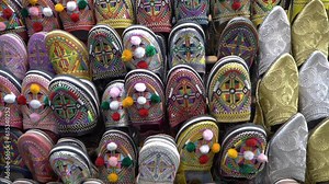 Discover the rich heritage of Morocco with authentic belgha leather shoes in Marrakech's vibrant old medina market.