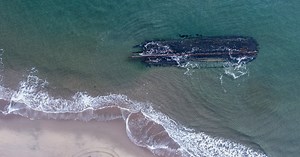 Mysterious shipwreck washes ashore in eastern Canada coastal community