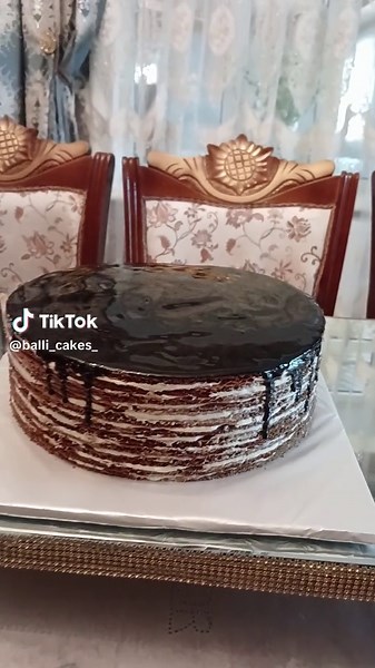 Delicious Multi-Layered Cake with Glossy Chocolate Glaze