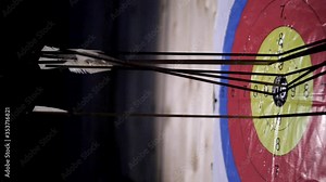 The arrow hits the target. Lots of arrows hit the targets. The arrow hits the target. Accurate archer shooting. Accuracy competition. Targets are hit with an arrow. Archery at a distant target.