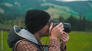 Photographer takes a photo on close-up in nature.