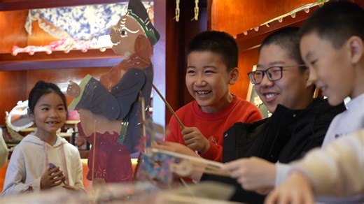 In Changji, Xinjiang Uygur Autonomous Region, the ancient art of shadow puppetry is captivating children during the Spring Festival. With a lamp, a screen, and skilled fingers, performers bring classic tales like "The Crane and the Turtle" to life, blending tradition with festive charm. After the shows, children learn about the craft's history and techniques, while newly adapted short plays incorporate local Xinjiang elements and New Year themes, making this intangible cultural heritage more acc