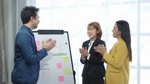 group of Asian men and women business teams applauded their business successes to their office friends Young businessme... n and businesswomen applaud their congratulations to the company.