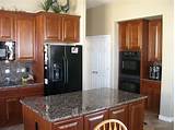 Black Stainless Appliances With Cherry Cabinets