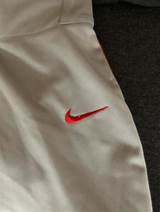 Photos of Nike Gray Baseball Pants With Red Piping