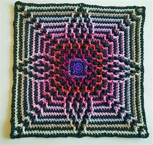 A Crocheted Square With An Intricate Design On It
