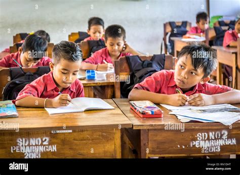 Indonesian children studying in classroom