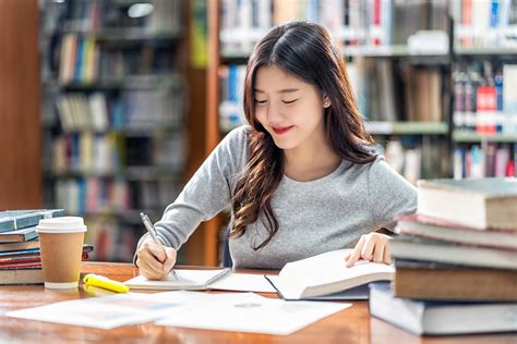 Student studying by using books to learn