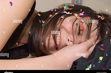 girl alamy asleep stock laughing confetti covered during party drunk