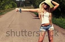 hitchhiking young along pretty road woman shutterstock stock logo search