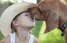 dog kissing girl caucasian outdoors dissolve stock blend d145