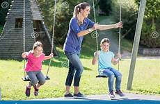 playground swing mother family two girls