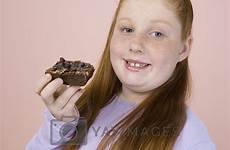 girl obese teenage portrait happy yayimages pastry holding stock royalty terms