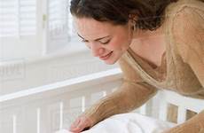 baby tucking mother hispanic sleeping crib room dissolve stock blend cradle d145