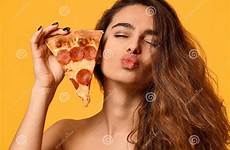 pizza hold eat woman young beautiful pepperoni slice lips kissing yellow sign show