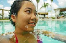 swimming indonesian teenager pool asian girl tropical outdoors smiling resort portrait sweet happy young beautiful destination