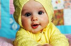baby cute yellow background blue wearing dress blur wool lying knitted bed down wallpapers wallpaper