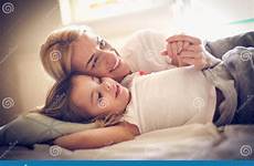 lying daughter bed mother portrait happy preview