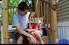 sister crying consoling boy stock alamy