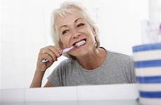 teeth brushing woman senior heart istockphoto bathroom disease do older gums stock bleeding help gum tips mouth healthy cancer pic
