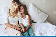 tween daughter mom bed stock relations relaxing feelings positive good her resting