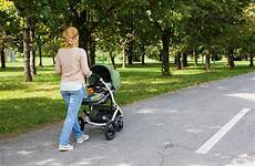 pushing stroller baby mother