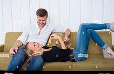 lap sitting boyfriend boyfriends girlfriend lying alamy woman stock croissant smiling eating while