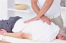 doctor massaging back shutterstock
