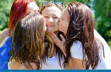 kissing girls each cute other beautiful four fun friends women young smiling summer having happy garden portrait stock
