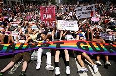 guns gays against pride parade york gay marches gun protest massacre jubilation times solemn tributes victims nyc damon winter