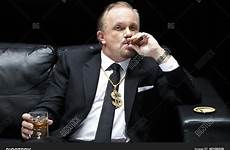 boss mafia smoking cigar stock