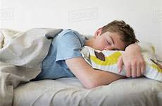 sleeping boy teenage bed stock dissolve d1028
