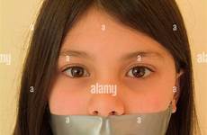 tape mouth girl over young stock her alamy