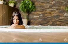 tub hot relaxing woman young stock