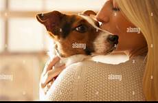 dog kissing woman young alamy stock