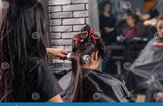 hairdresser brushing blow drying held