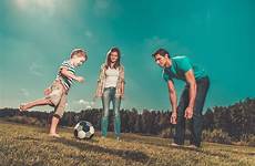 family partner introducing kids playing football young pitch soccer popsugar introduce shares stock