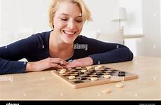 playing checkers caucasian alamy